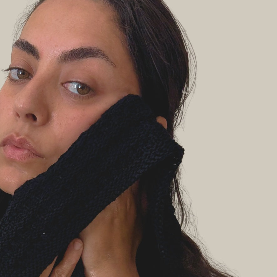 woman-using-organic-cotton-wash-cloth