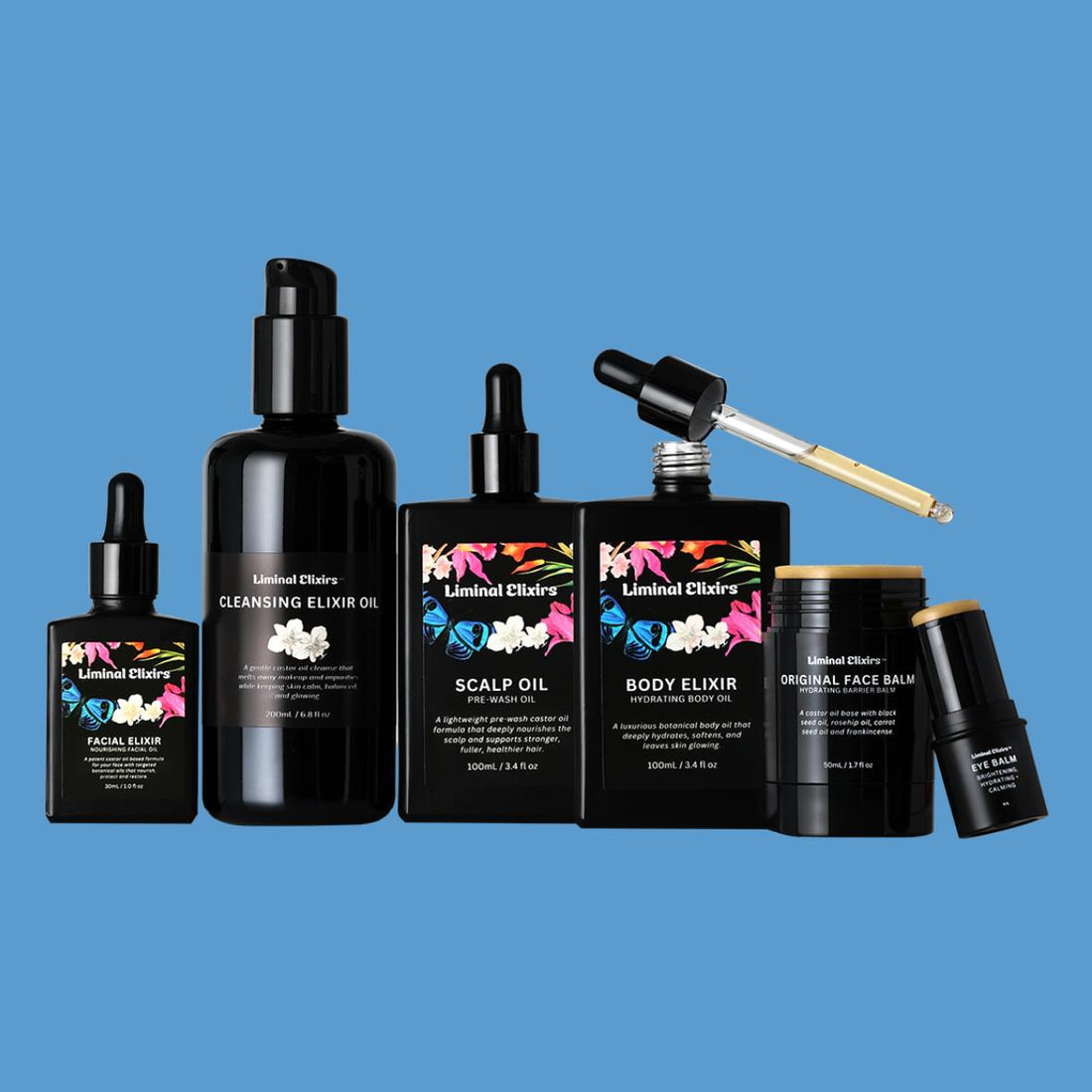 Collection of Liminal Elixir skincare products in Everything Bundle on a blue background