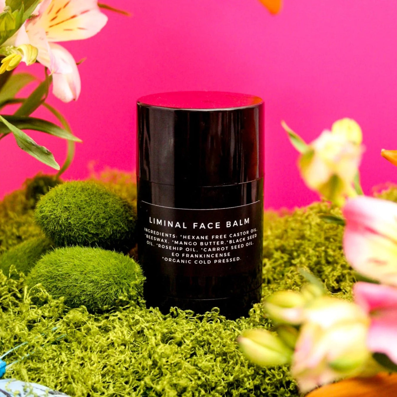 Black cylindrical container labeled &