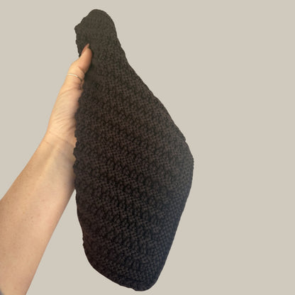 hand holding Liminal Elixirs organic cotton wash cloth