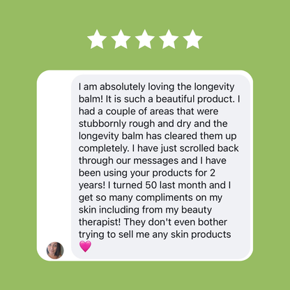 Five-star review of a longevity balm on a green background
